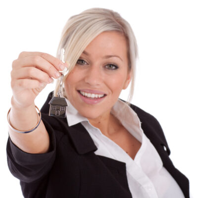 real estate agent with keys over white background
